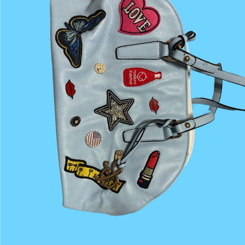 Stylish Blue Handbag with Fun Patches